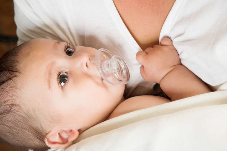 How do pacifiers affect breastfeeding